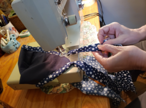 Sewing the ties onto the MakerMask:Fit