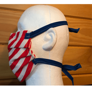 Photo: The MakerMask: Surge, a three-layer pleated mask made with spunbond nonwoven polypropylene and cloth ties, shown on a mannequin head