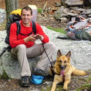 Matt White with his Seeing Eye dog Yoshi, with a full pack, backpacking on the Appalachian Trail in Pennsylvania