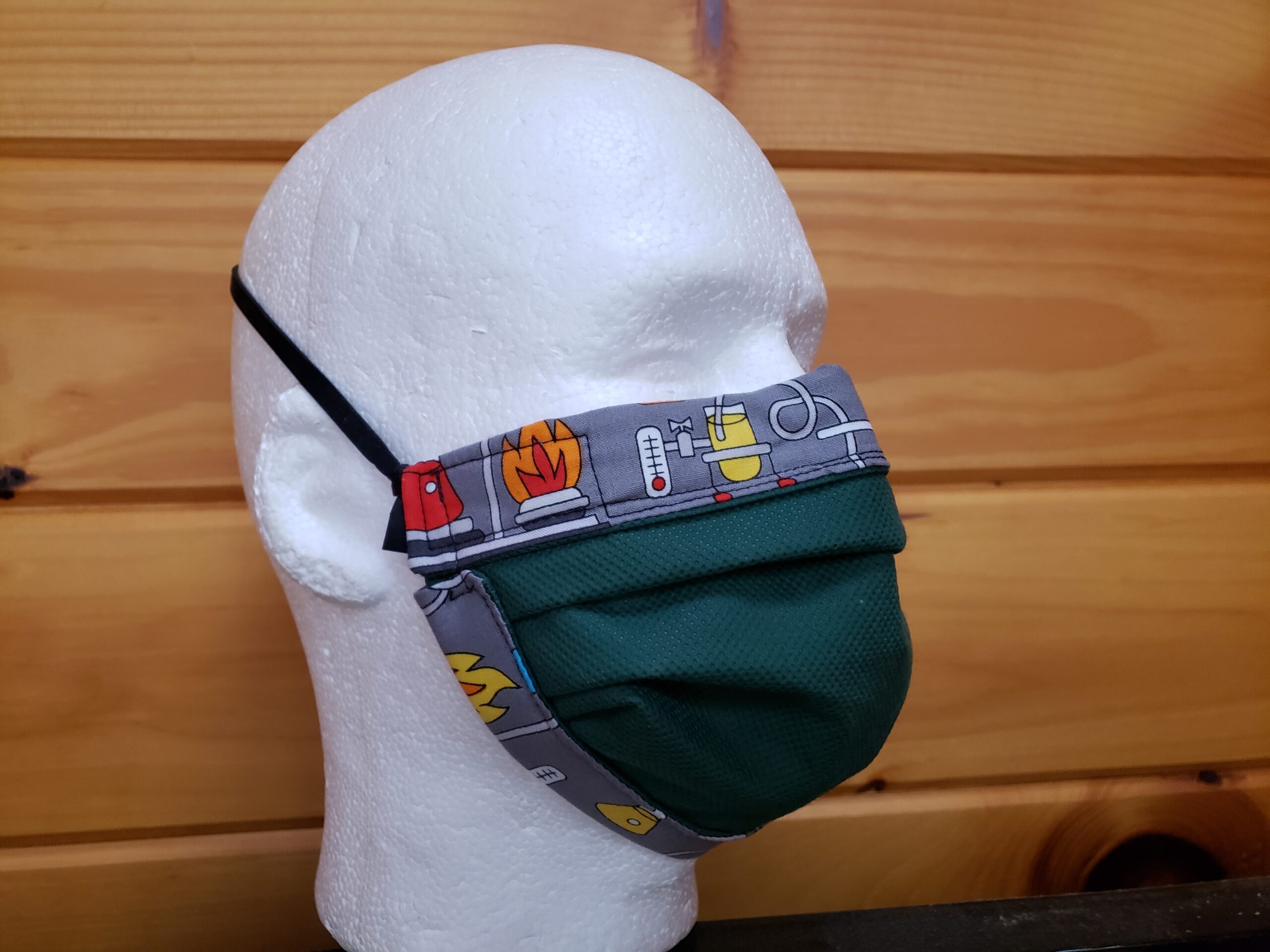 Photo of a 3-layer MakerMask:Origami fitted mask constructed from nonwoven polypropylene and tightly woven cotton